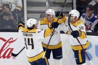Nashville Predators' Colton Sissons (10) celebrates his goal with Kiefer Sherwood (44) and Tyson Barrie (22) during the first period of an NHL hockey game against the Boston Bruins, Saturday, Oct. 14, 2023, in Boston. (AP Photo/Michael Dwyer)
