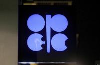 The advertising label of the Organization of the Petroleum Exporting Countries, OPEC, shines at their headquarters in Vienna, Austria, Austria, Thursday, Dec. 5, 2019. The countries that make up the OPEC oil-producing cartel are meeting Thursday to decide whether to cut production in order to support the price of fuel and energy around the world.(AP Photo/Ronald Zak)