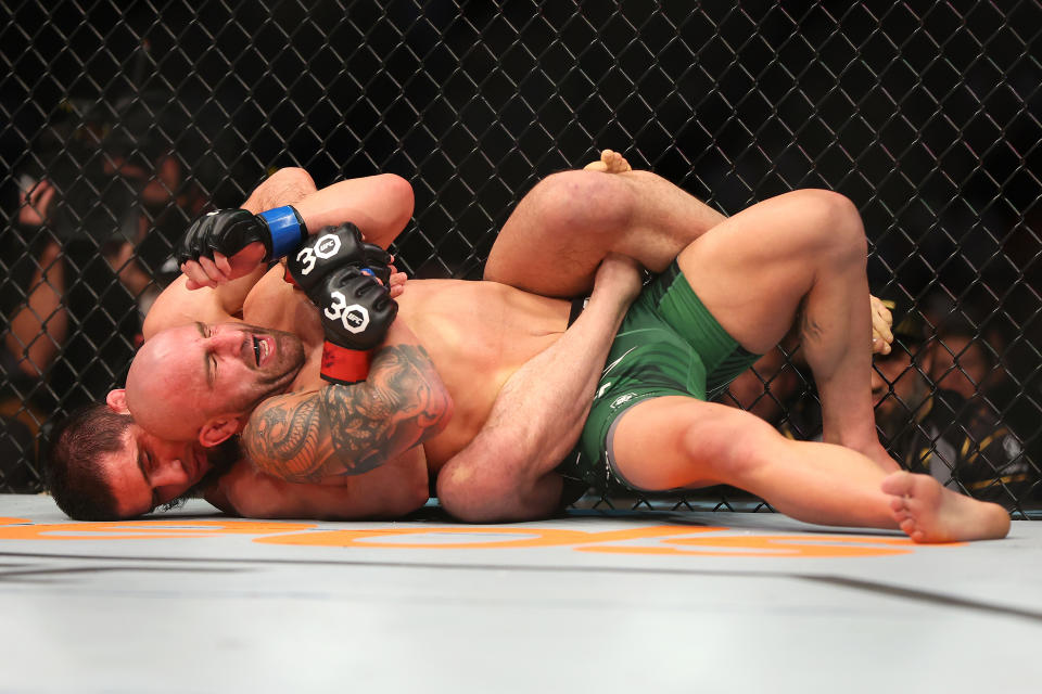 PERTH, AUSTRALIA - FEBRUARY 12: Islam Makhachev of Russia 
battles Alex Volkanovski of Australia in the UFC lightweight championship fight during UFC 284 at RAC Arena on February 12, 2023 in Perth, Australia. (Photo by Paul Kane/Getty Images)