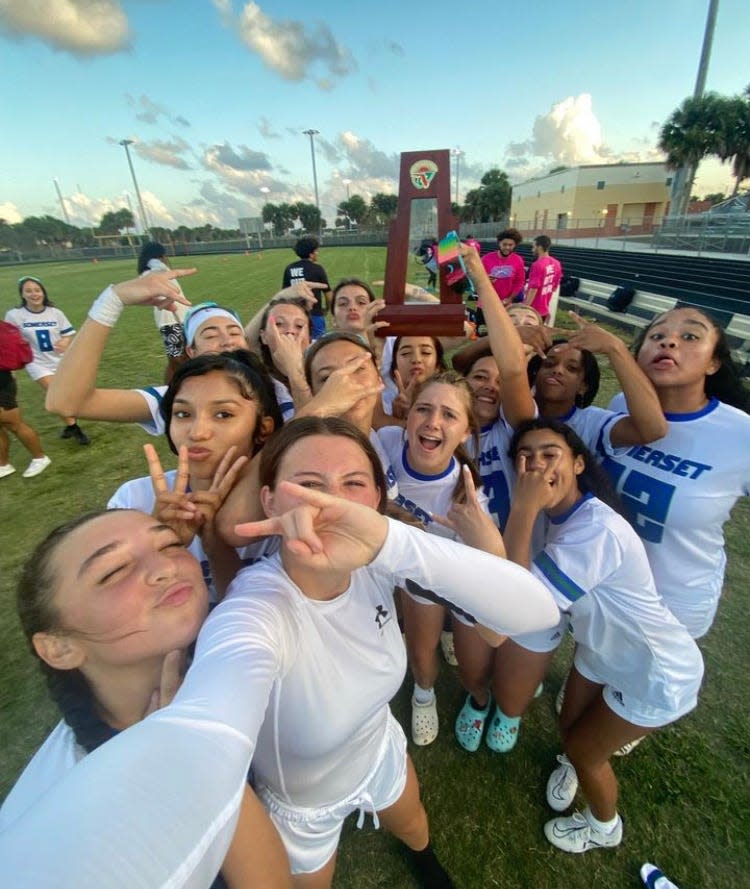 Somerset Academy-Canyons flag football celebrates after clinching the program's first district championship in school history. The Cougars made an unlikely 15-6 push to region finals.