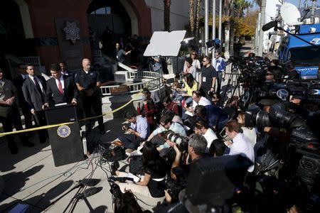 FBI Los Angeles Assistant Director in Charge David Bowdich speaks as San Bernardino Police Department Chief Jarrod Burguan looks on during a news conference about last week's shooting in San Bernardino, California, December 7, 2015. REUTERS/Patrick T. Fallon