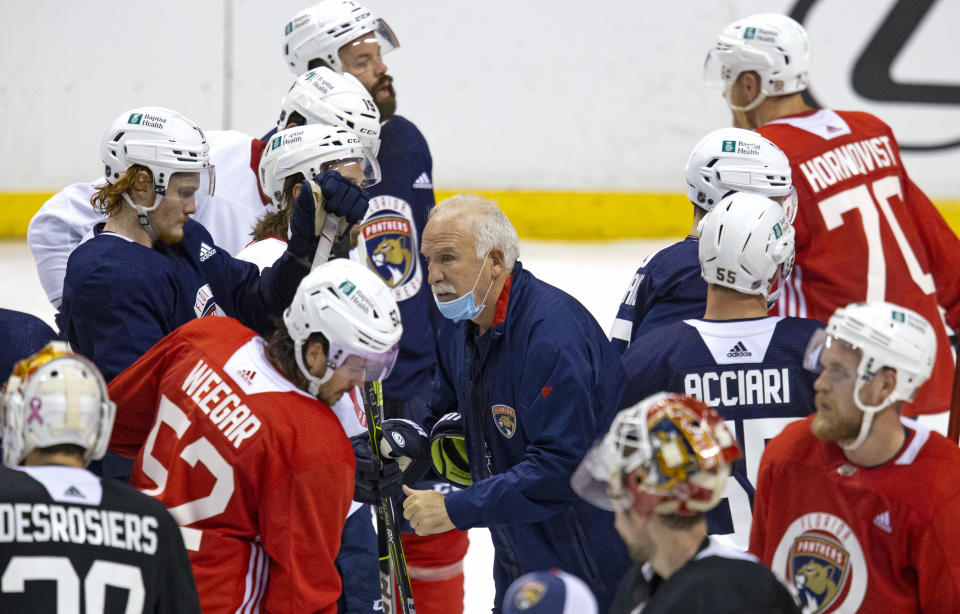 Florida Panthers head coach Joel Quenneville gives instructions to his team during NHL training camp, Wednesday, Jan. 13, 2021 in Sunrise, Fla. (David Santiago/Miami Herald via AP)