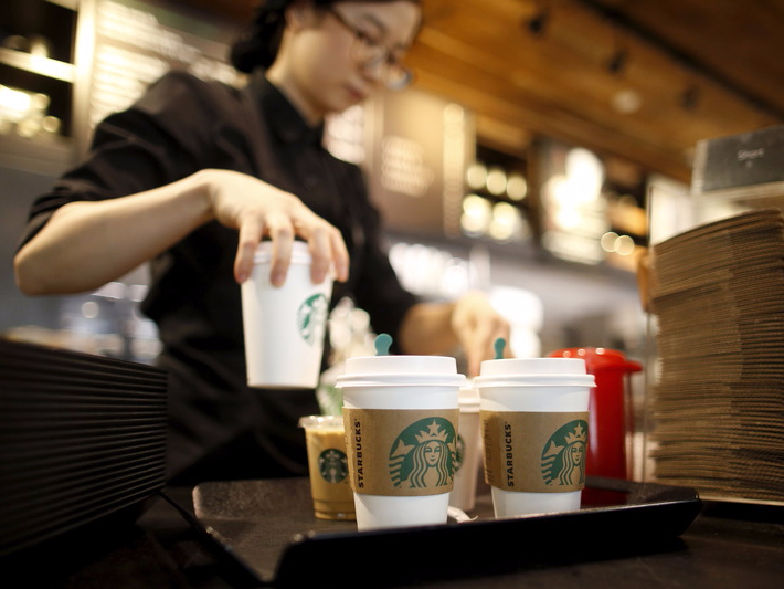 A staff serves beverages at a Starbucks coffee shop in Seoul, South Korea, March 7, 2016. Picture taken March 7, 2016. REUTERS/Kim Hong-Ji 