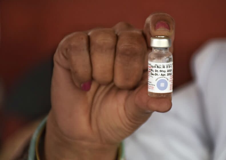 A Health worker showing a vial polio vaccine