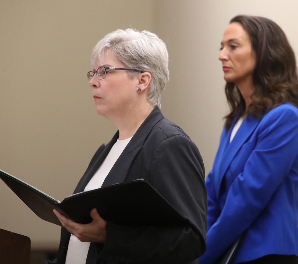 Summit County Medical Examiner Lisa Kohler discusses the results of Jayland Walker's autopsy as Greta Johnson, director of communications and the assistant chief of staff for Summit County Executive, stands right, during a press conference at Summit County Public Health on Friday in Akron. 