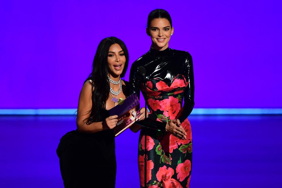 US television personalities Kim Kardashian and Kendall Jenner present the award for Outstanding Competition Program onstage during the 71st Emmy Awards 