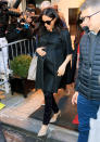 For her NYC baby shower, Meghan wore a vintage Courreges Haute Couture black trapeze coat in matelassé silk, circa 1965. She paired the look with a Carolina Herrera bag, Le Specs sunnies and Hatch maternity jeans. [Photo: Getty]