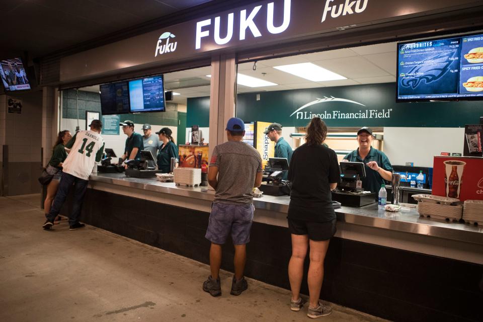 In 2018, Eagles fans grab food at Fuku, a concession stand at Lincoln Financial Field.