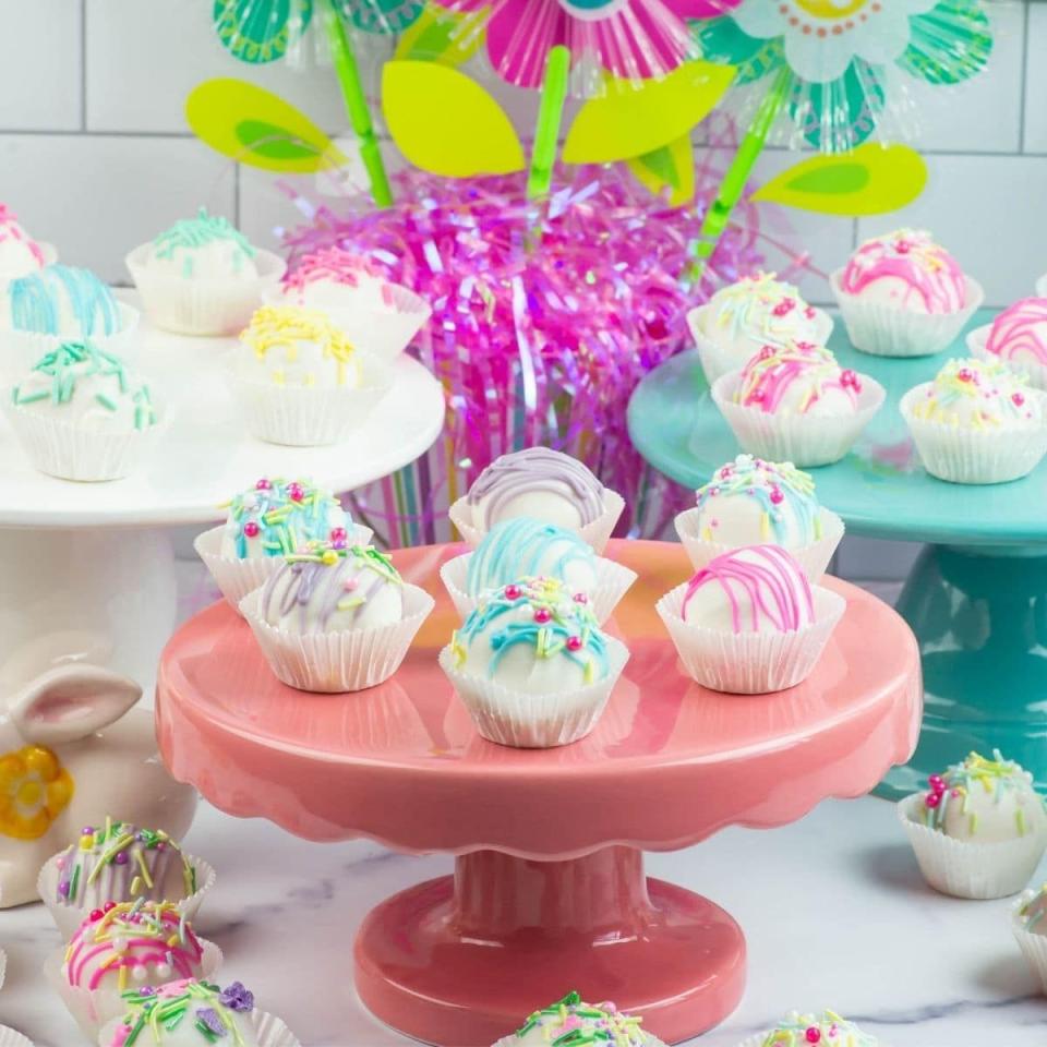<p>Sweet carrot cake is rolled and dunked into white chocolate for a bite-sized dessert. The kids will love decorating these. </p><p>Get the <strong><a href="https://flouronmyface.com/easter-cake-balls/" rel="nofollow noopener" target="_blank" data-ylk="slk:Easy Easter Carrot Cake Balls recipe;elm:context_link;itc:0;sec:content-canvas" class="link ">Easy Easter Carrot Cake Balls recipe</a></strong> from Flour On My Face.</p>