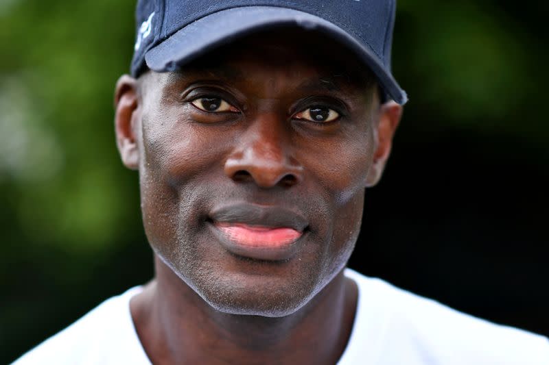 FILE PHOTO: Patrick Hutchinson, a black protester who carried a white man to safety during clashes, poses for a portrait in London