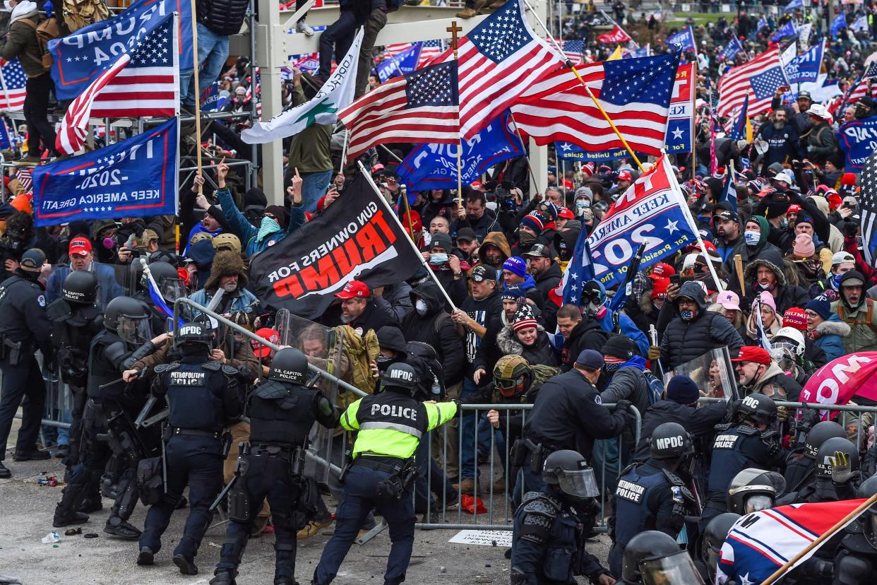 Demonstrators breech security before entering the Capitol to try to stop Congress from certifying the 2020 presidential election.  (Photo: ROBERTO SCHMIDT/AFP via Getty Images)