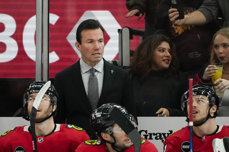 Chicago Blackhawks head coach Luke Richardson watches from the bench after his team scored against the Colorado Avalanche during the first period of an NHL hockey game Tuesday, Dec. 19, 2023, in Chicago. (AP Photo/Erin Hooley)