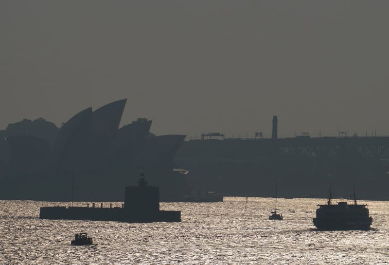 The Sydney Opera House is seen through smoke from bushfires in Sydney
