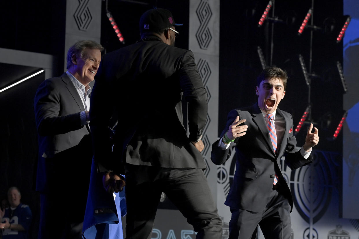 NFL draft: Kayvon Thibodeaux and Sam Prince celebrate as Roger Goodell looks on. (David Becker/Getty Images)