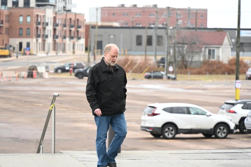 Yassin Choukri walks toward the Moncton courthouse on Tuesday before being sentenced.