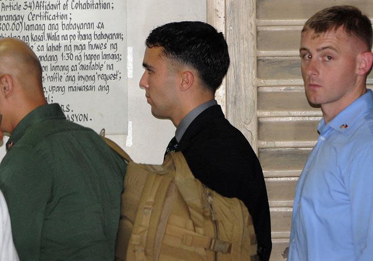 US Marine Private First Class Joseph Scott Pemberton (centre) leaves a court building in the Philippine city of Olongapo, on March 23, 2015