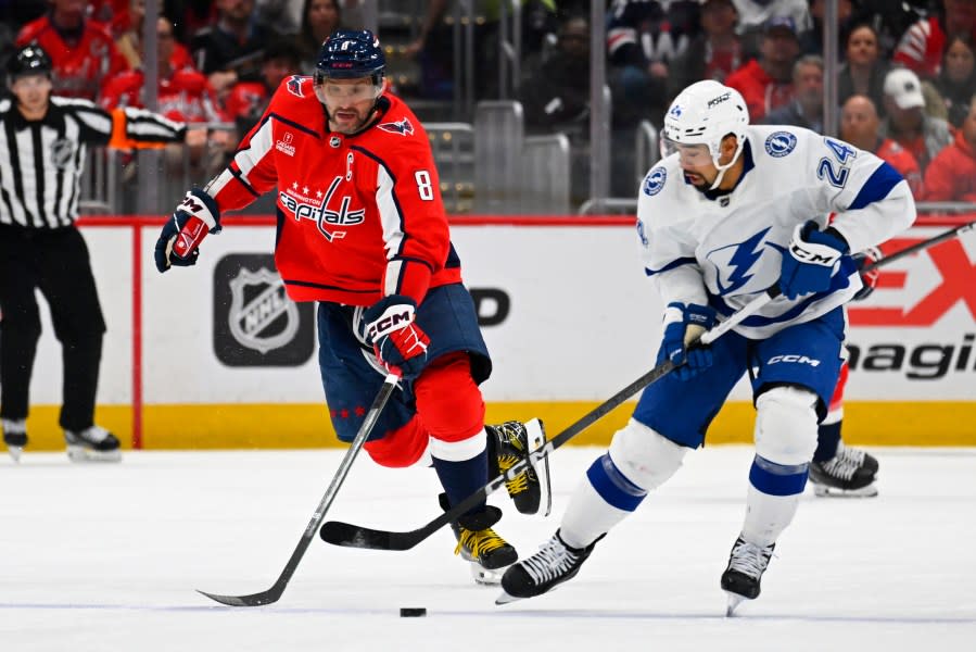 Washington Capitals left wing <a class="link " href="https://sports.yahoo.com/nhl/players/3637/" data-i13n="sec:content-canvas;subsec:anchor_text;elm:context_link" data-ylk="slk:Alex Ovechkin;sec:content-canvas;subsec:anchor_text;elm:context_link;itc:0">Alex Ovechkin</a> (8) and Tampa Bay Lightning defenseman <a class="link " href="https://sports.yahoo.com/nhl/players/5687/" data-i13n="sec:content-canvas;subsec:anchor_text;elm:context_link" data-ylk="slk:Matt Dumba;sec:content-canvas;subsec:anchor_text;elm:context_link;itc:0">Matt Dumba</a> (24) contend for control of the puck during the first period of an NHL hockey game Saturday, April 13, 2024, in Washington. (AP Photo/John McDonnell)