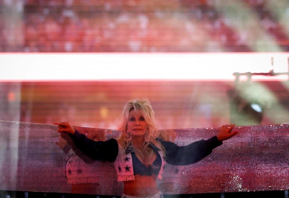 Dolly Parton performs during the Dallas Cowboys’ halftime show to kickoff the Red Kettle Campaign on Thursday, November 23, 2023, at AT&T Stadium in Arlington. Amanda McCoy/amccoy@star-telegram.com