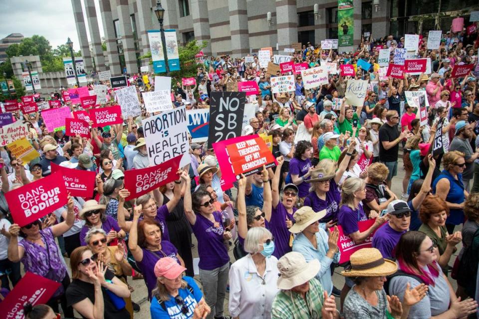 Hundreds of abortion ban veto supporters turned out to watch Gov. Roy Cooper sign a veto of the on Bicentennial Mall in Raleigh Saturday, May 19, 2023.
