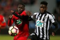 Soccer Football - SCO Angers v EA Guingamp - French Cup Semi-Final - Raymond Kopa Stadium, Angers, France - 25/04/2017. Guingamp's Alexandre Mendy and SCO Angers' Ismael Traore in action. REUTERS/Stephane Mahe -