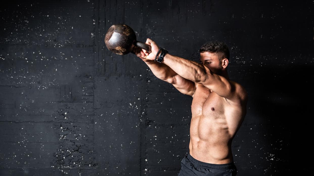  a man doing a woodchop exercise 