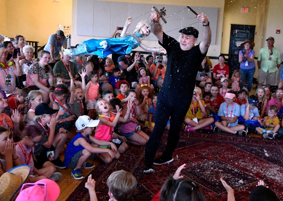 Kent Williams of Gepetto's Marionette Theater entertains children at the Elks Art Center during last year's Children's Art & Literacy Festival.