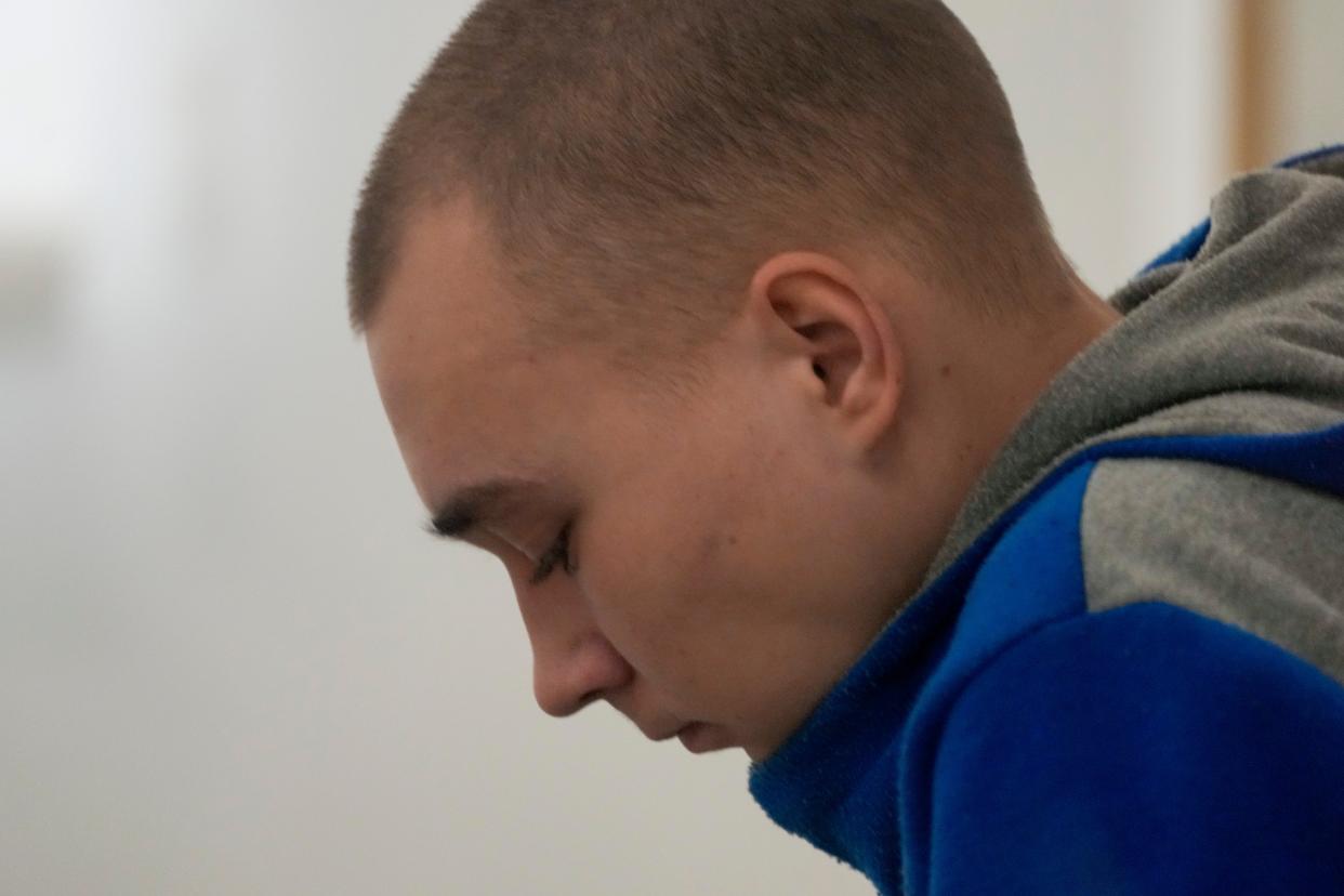 Russian Sgt. Vadim Shishimarin waits for the start of a court hearing in Kyiv, Ukraine, on May 23, 2022. He is the first soldier convicted of war crimes since Russia invaded Ukraine.