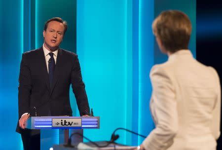 David Cameron, the leader of the Conservative Party and Britain's current prime minister, speaks during the leaders televised election debate at Media City in Salford in Northern England, in this April 2, 2015 handout picture provided by ITV. REUTERS/Ken McKay/ITV/Handout via Reuters ATTENTION EDITORS - THIS PICTURE WAS PROVIDED BY A THIRD PARTY. REUTERS IS UNABLE TO INDEPENDENTLY VERIFY THE AUTHENTICITY, CONTENT, LOCATION OR DATE OF THIS IMAGE. FOR EDITORIAL USE ONLY. NOT FOR SALE FOR MARKETING OR ADVERTISING CAMPAIGNS. THIS PICTURE IS DISTRIBUTED EXACTLY AS RECEIVED BY REUTERS, AS A SERVICE TO CLIENTS. NO SALES. NO ARCHIVES.