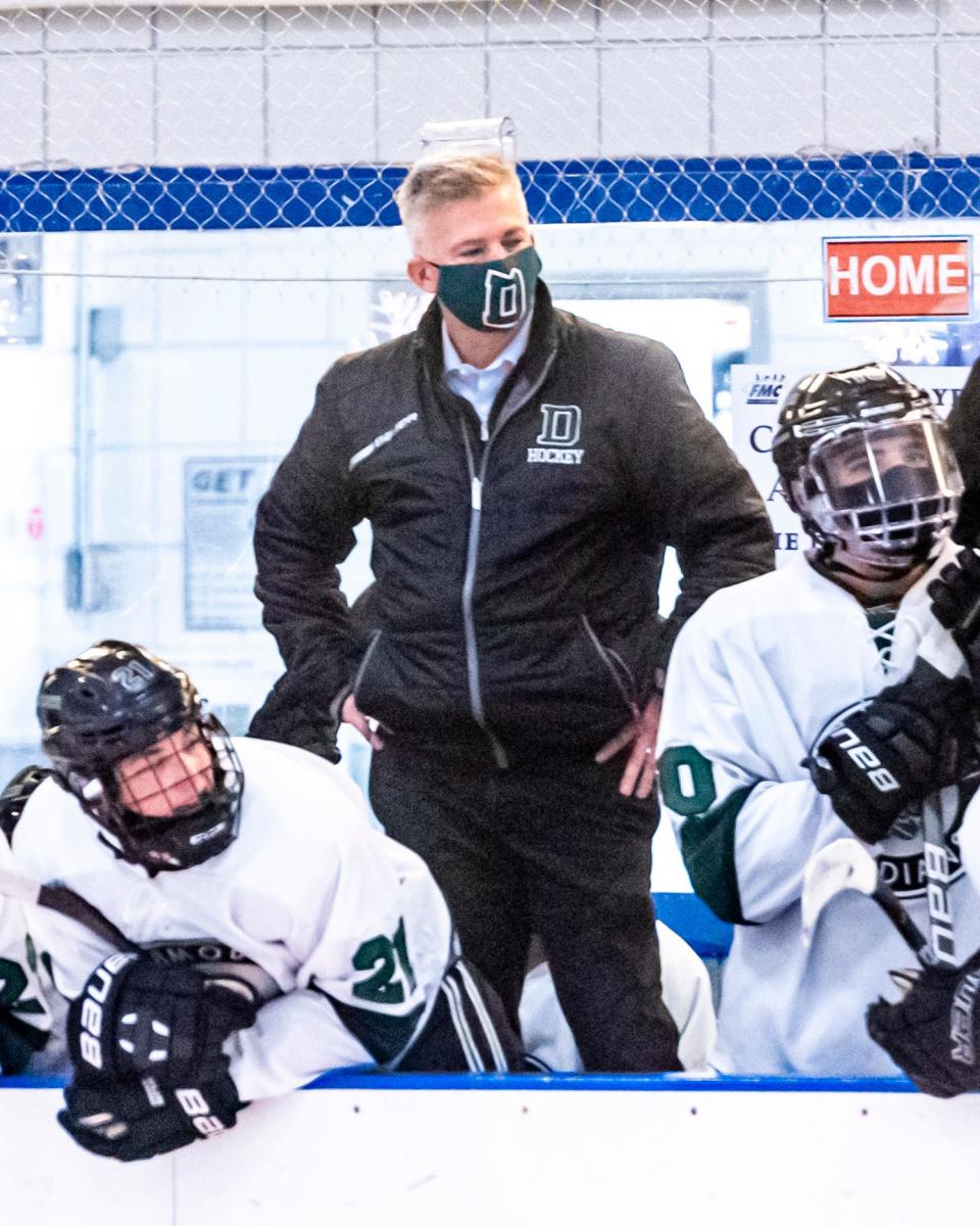 Dartmouth ice hockey coach Mike Cappello mans the bench for the Indians.