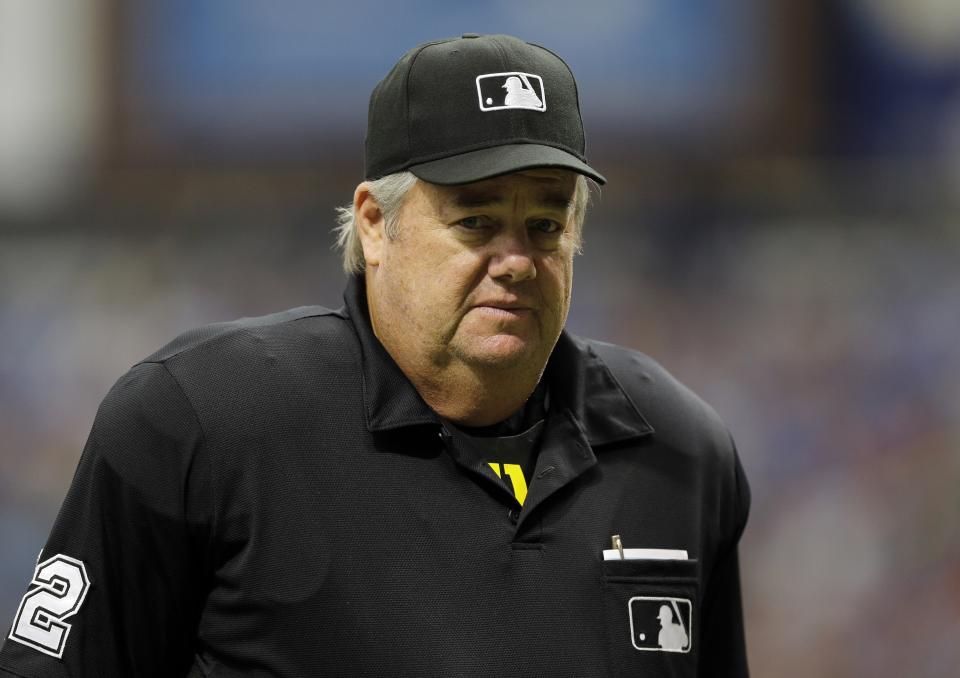 Home plate umpire Joe West during the first inning of a baseball game between the Tampa Bay Rays and the Oakland Athletics Sunday, May 24, 2015, in St. Petersburg, Fla.  (AP Photo/Chris O'Meara)