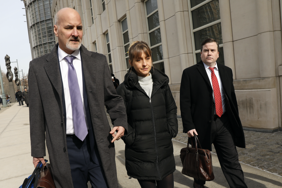 actress allison mack leaves the brooklyn federal courthouse with her lawyers after a court appearance surrounding the alleged sex cult nxivm on february 06, 2019 in new york city