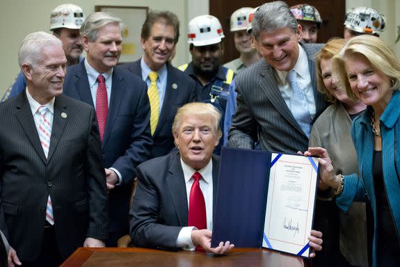 President Trump signs a resolution in February disapproving  a rule addressing the impacts of surface coal mining operations on "surface water, groundwater, and the productivity of mining operation sites."