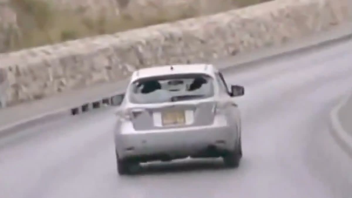 A video purportedly showed an Israeli person driving a hatchback car and striking two children who were reportedly throwing rocks. 