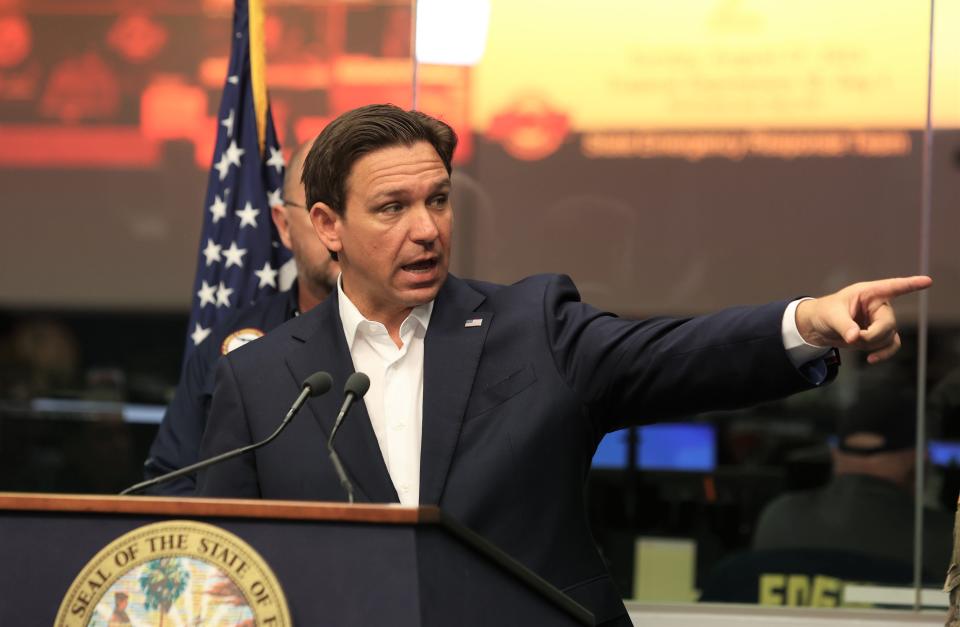 Florida Gov. Ron DeSantis points to a map that shows the projected path of Tropical Storm Idalia at the State Emergency Operations Center in Tallahassee on Sunday, Aug. 27, 2023.
