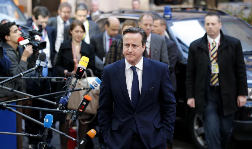 British Prime Minister David Cameron, center, arrives for an EU summit in Brussels on Thursday, March 6, 2014. European Union leaders are holding an emergency summit to decide on imposing sanctions against Russia over its military incursion in Ukraine's Crimean peninsula. The EU leaders were gathering Thursday as the 28-nation bloc seeks to find the right response to the conflict unfolding just beyond its eastern border in Ukraine. (AP Photo/Michel Euler)