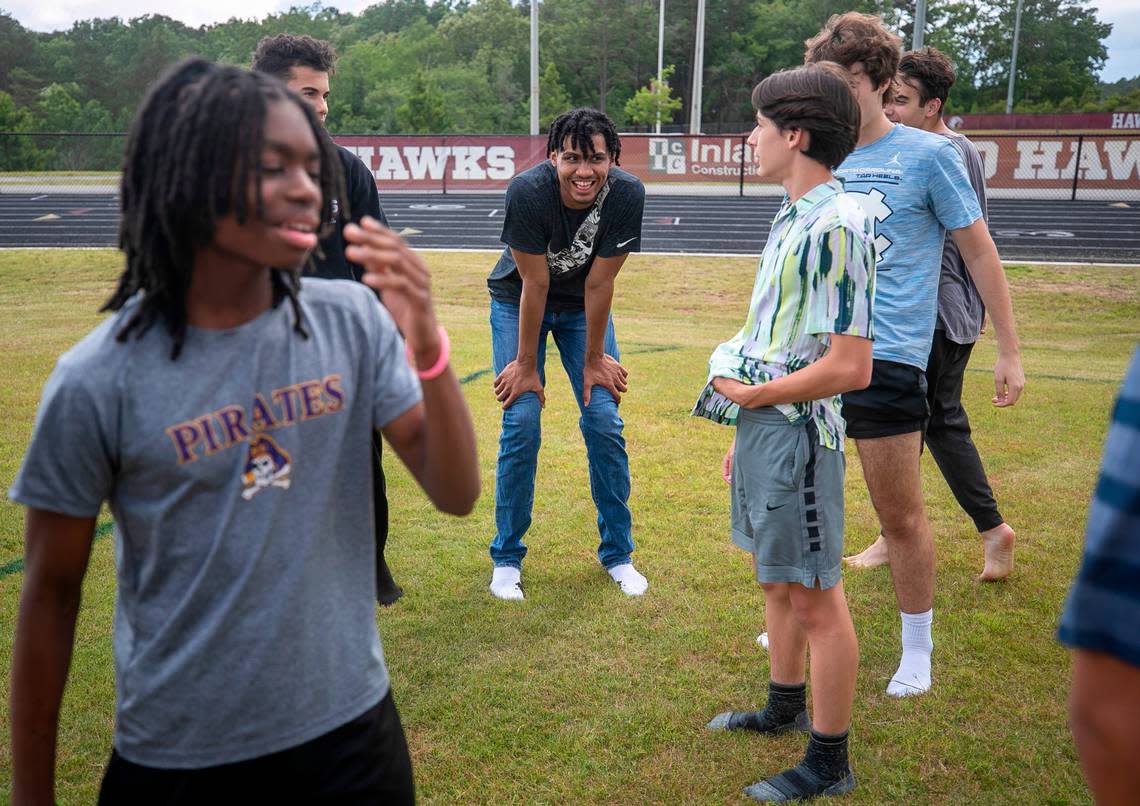 Jarin Stevenson talks with his classmates after playing on an inflatable obstacle course, during the year end athletic celebration on Thursday, June 1, 2023 at Seaforth High School in Pittsboro, N.C. 
