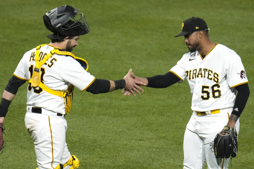 Pittsburgh Pirates relief pitcher Duane Underwood Jr. (56) celebrates with catcher Austin Hedges after getting the final out of a 2-1 win over the Cincinnati Reds in a baseball game in Pittsburgh, Saturday, April 22, 2023. (AP Photo/Gene J. Puskar)