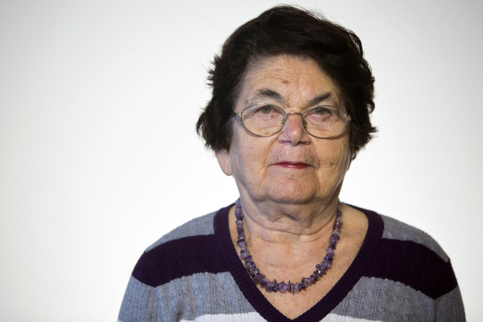 In this photo taken Wednesday, April 9, 2014, Israeli Holocaust survivor Ester Koffler Paul, 82, originally from what is now Ukraine, poses for a portrait in Jerusalem. When she thinks back on her Holocaust ordeal, she mostly remembers her sister. Paul was 8, and her sister Nunia was 10 in 1941, when the Nazis invaded their hometown of Buchach in what is now Ukraine. Their mother died before the war and their father was taken by the Nazis and murdered along with 700 other Jewish men. (AP Photo/Sebastian Scheiner)