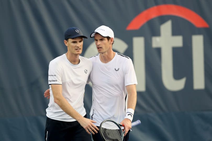 Andy Murray (R) and his brother Jamie Murray of Great Britain after losing in their doubles match against Raven Klaasen of Russia and Michael Venus of New Zealand