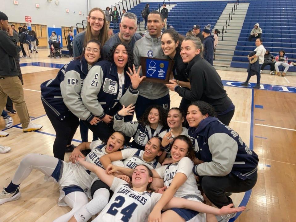 Union City girls basketball celebrates after beating Eastside for the North 1, Group 4 title on Monday, Feb. 27, 2023.