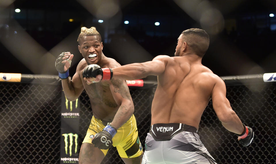 Jan 21, 2023; Rio de Janeiro, Brazil; Ismael Bonfim (red gloves) fights Terrance McKinney (blue gloves) during UFC 283 at Jeunesse Arena. Mandatory Credit: Jason da Silva-USA TODAY Sports