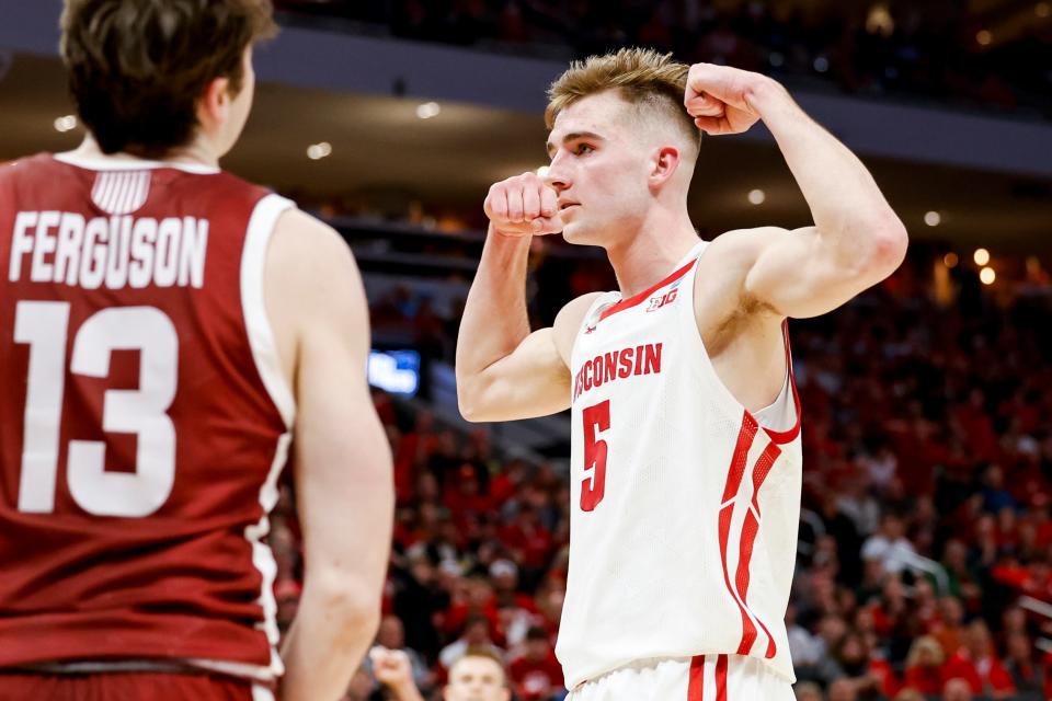 Wisconsin forward Tyler Wahl flexes after making a shot against Colgate in a first-round NCAA Tournament game at Fiserv Forum in 2022.