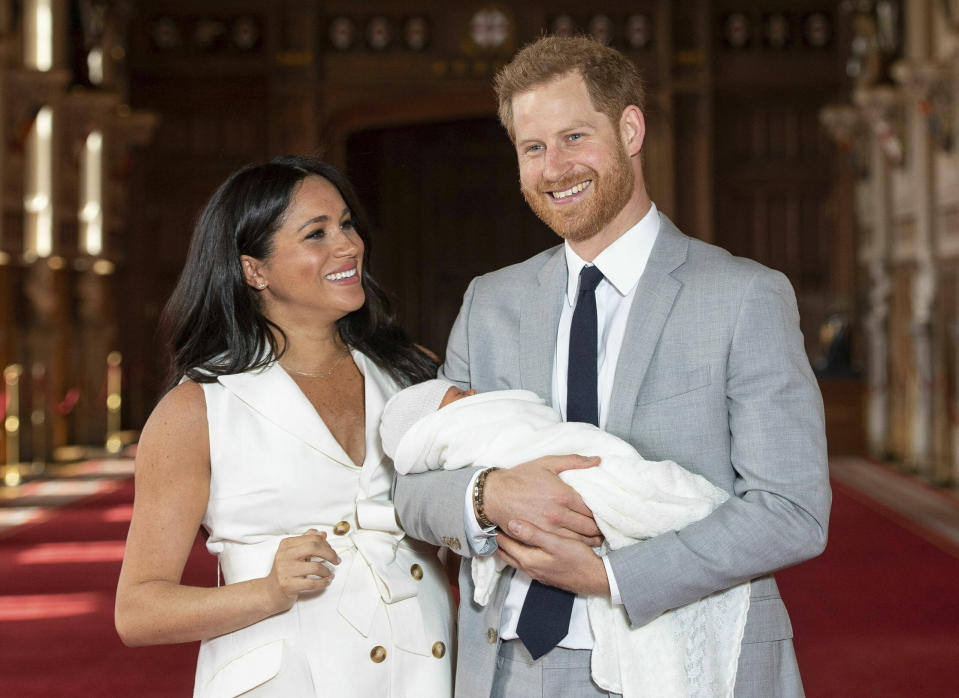 Britain's Prince Harry and Meghan, Duchess of Sussex, during a photocall with their newborn son, in St George's Hall at Windsor Castle, Windsor, south England, Wednesday May 8, 2019. Baby Sussex was born Monday at 5:26 a.m. (0426 GMT; 12:26 a.m. EDT) at an as-yet-undisclosed location. An overjoyed Harry said he and Meghan are "thinking" about names. (Dominic Lipinski/Pool via AP)