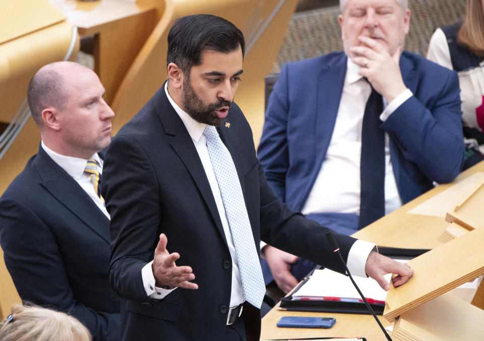 Scotland's First Minister Humza Yousaf speaks during First Minster's Questions (FMQ's) at the Scottish Parliament in Holyrood, Edinburgh, Thursday April 25, 2024. The Scottish National Party has ended its three-year power-sharing agreement with the much smaller Greens after tensions grew between the two pro-independence parties over climate change policies. Humza Yousaf, Scotland’s first minister, informed the Greens on Thursday he was terminating the agreement with immediate effect. (Lesley Martin/PA via AP)