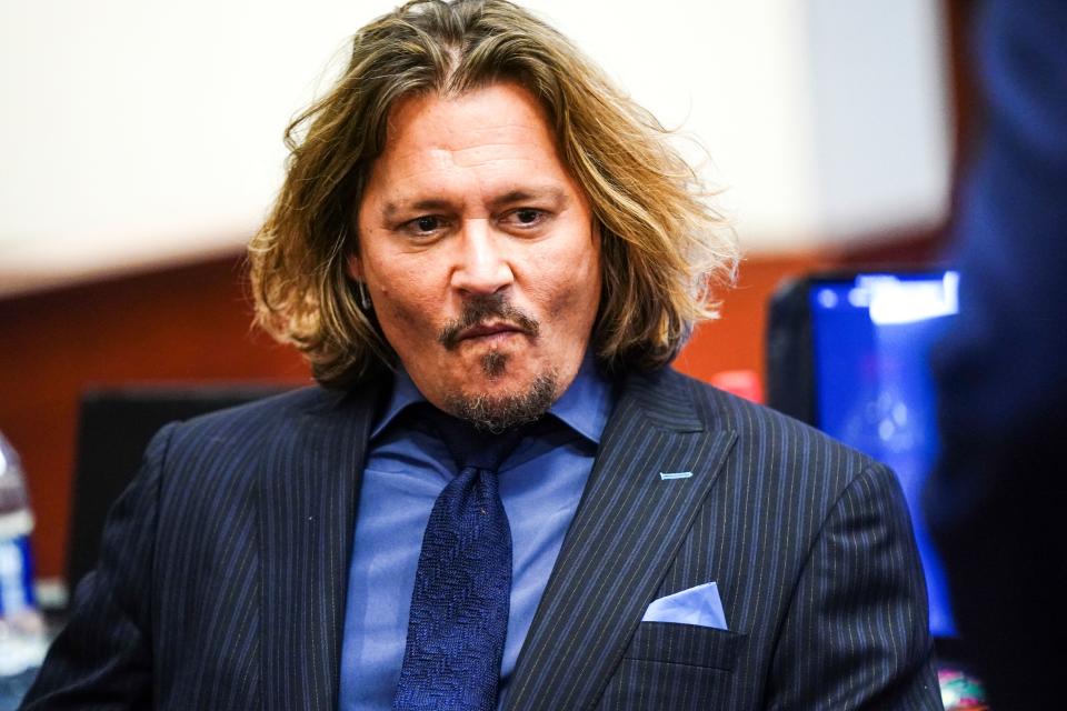 US actor Johnny Depp sits in the courtroom during the 50 million US dollars Depp vs Heard defamation trial at the Fairfax County Circuit Court in Fairfax, Virginia, on April 14, 2022. - Heard is being sued for defamation by her former husband, US actor Johnny Depp, after she wrote an op-ed in The Washington Post in 2018 that, without naming Depp, accused him of domestic abuse. (Photo by Shawn THEW / POOL / AFP) (Photo by SHAWN THEW/POOL/AFP via Getty Images)