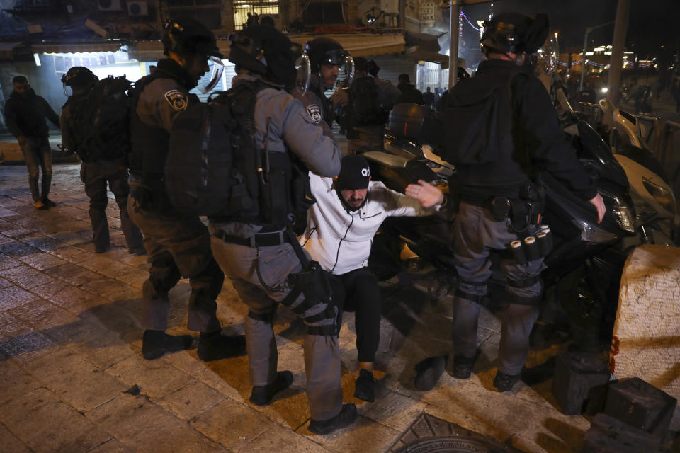 In this Thursday, April 22, 2021 file photo, Israeli riot police detain a Palestinian man during clashes near Damascus Gate just outside Jerusalem's Old City. A year of relative calm between Israel and the Palestinians has come to an abrupt halt in recent days with the eruption of nightly clashes between Arab youths and Israeli police in east Jerusalem and a heavy barrage of rocket fire launched from the Hamas-ruled Gaza Strip. (AP Photo/Mahmoud Illean, File)