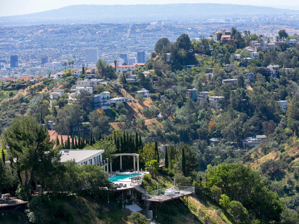 A home with a large pool is visible in the Hollywood Hills area, part of the Metropolitan Water District of Southern California.