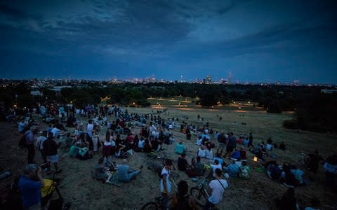 People gather on Primrose Hill hoping to catch sight of the blood red moon in total eclipse over London - Credit: Peter Macdiarmid/LNP