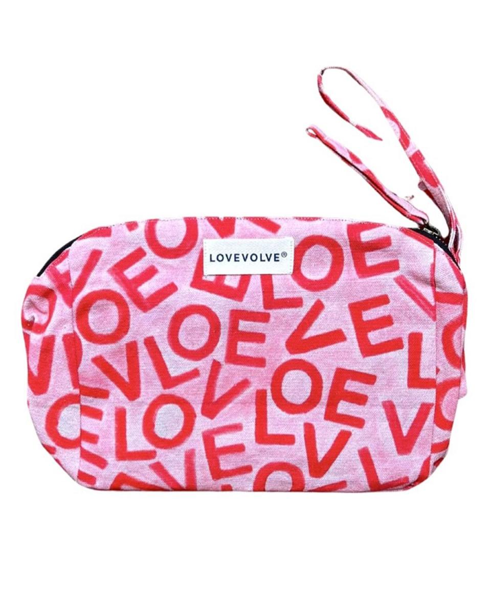 <p><a href="https://lovevolve.com/collections/give-love/products/cosmetic-bag?variant=39858537234467" rel="nofollow noopener" target="_blank" data-ylk="slk:Shop Now;elm:context_link;itc:0;sec:content-canvas" class="link ">Shop Now</a></p><p>Love Cosmetic Bag</p><p>lovevolve.com</p><p>$44.00</p>