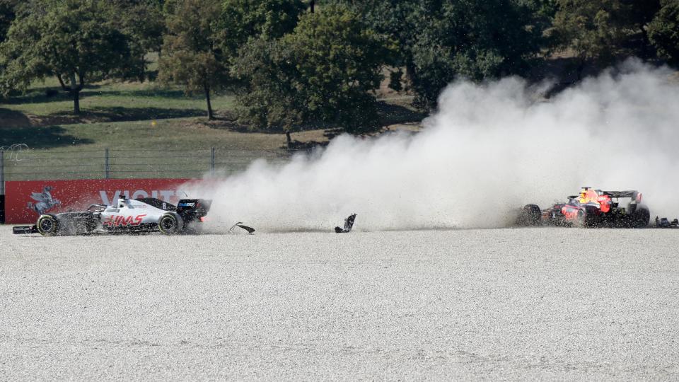 Haas F1's French driver Romain Grosjean (L) and Red Bull's Dutch driver Max Verstappen crash during during the Tuscany Formula One Grand Prix at the Mugello circuit in Scarperia e San Piero on September 13, 2020. (Photo by Luca Bruno / POOL / AFP) (Photo by LUCA BRUNO/POOL/AFP via Getty Images)